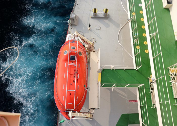 The totally enclosed lifeboat of an oil tanker, lifeboat deck and muster station. Top view.